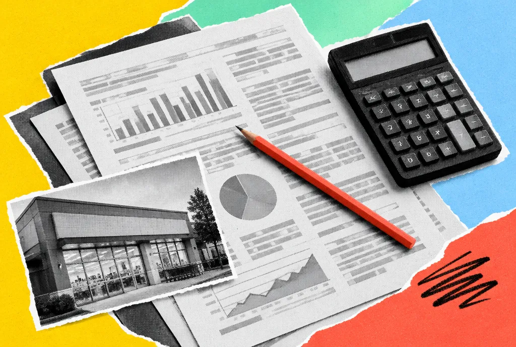 Printed financial filings on a desk beside a calculator, a small retail photograph and a single red pencil, arranged on a strong diagonal.